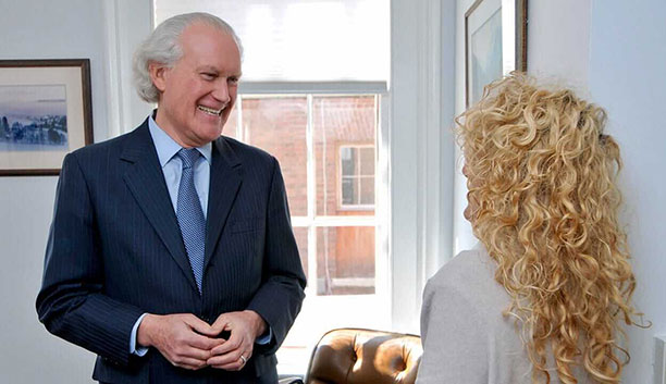 Charles C. Goetsch speaking with a client